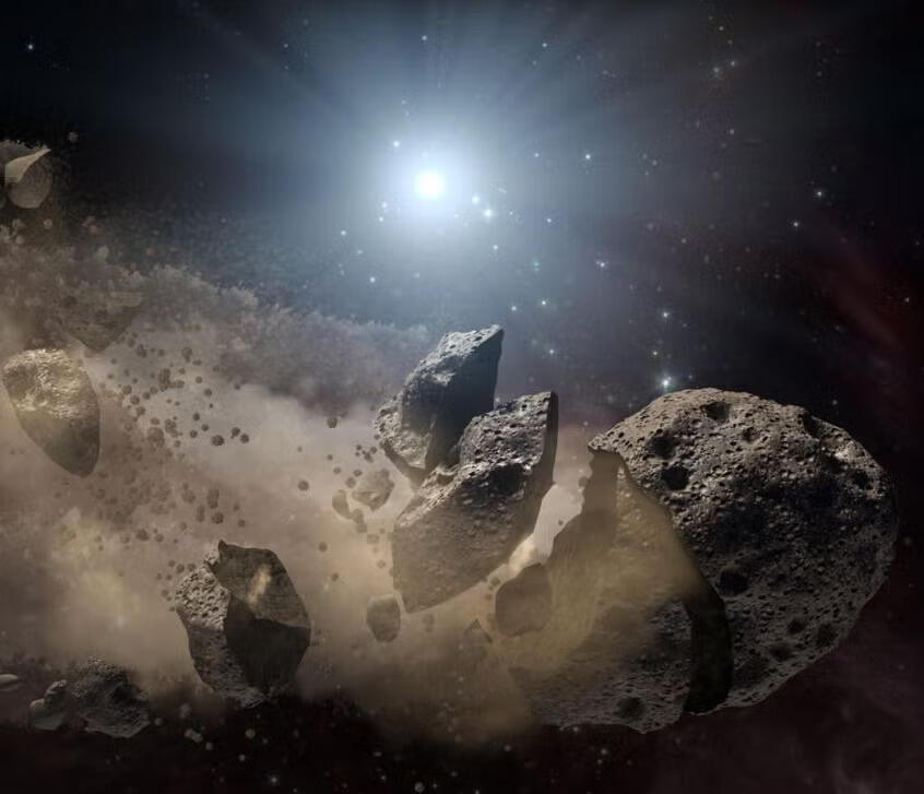 An illustration of an asteroid breaking up near a star